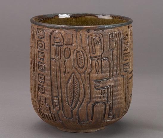 Brown stoneware with incised rain plant and Kachina figures