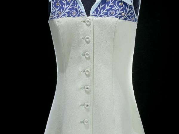 Billie Jean King&#039;s white tennis dress with a blue collar with light blue vines and rhinestones.
