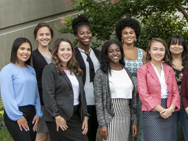 Diverse group of young women smiling.