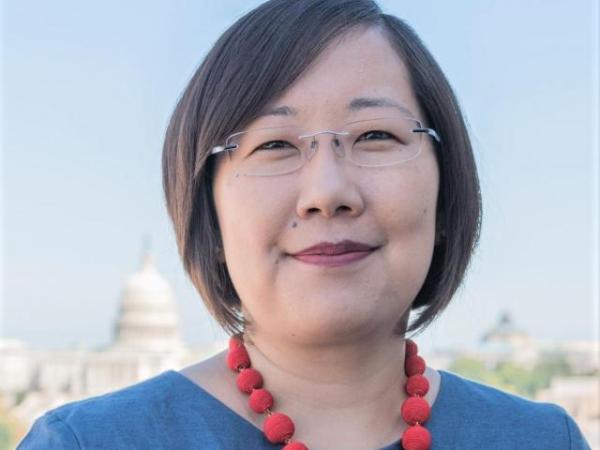 Lisa Sasaki stands in front of the U.S. capitol