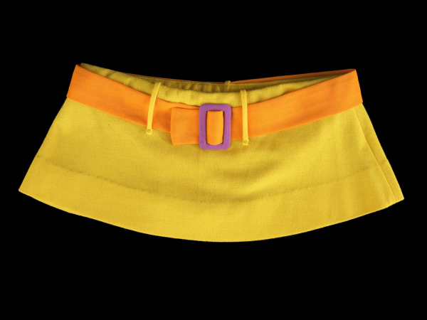 Very short yellow skirt with an orange belt and purple belt buckle
