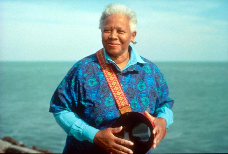 Photo of Ella Jenkin standing against the ocean horizon