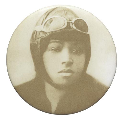 A circular button featuring a sepia portrait of Bessie Coleman wearing an aviator hat and goggles.