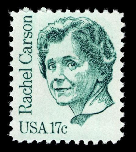White stamp with green ink art of Rachel Carson. She looks directly at the viewer.