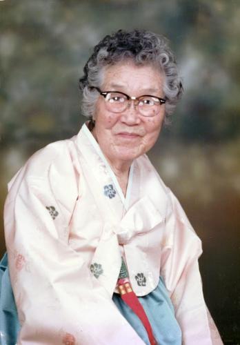 Color portrait of Sung Hark (Lee) Kang from the waist up facing the camera.