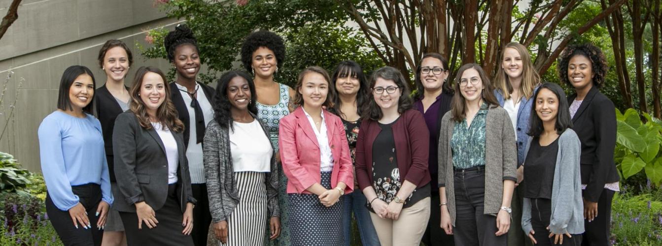 Diverse group of young women smiling.