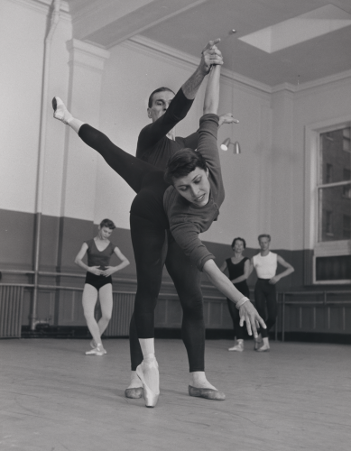 Black and white photo of Maria Tallchief doing ballet with a partner in a dance studio
