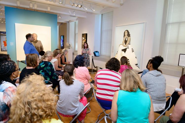 Briana Zavadil White speaks in a gallery full of teachers taking notes