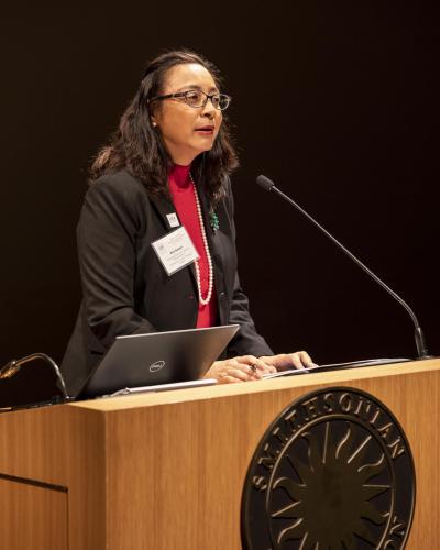 Oris Sanjur speaks at a podium